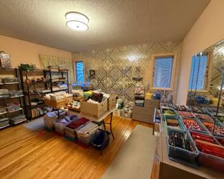 Craft room with storage shelving and work tables