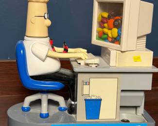 Novelty cartoon figure of an office worker at a computer