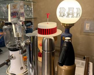 Bar area with cocktail shaker, thermos and lamp