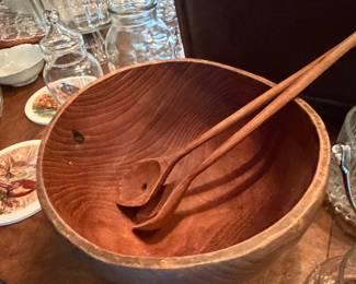 Large turned wood salad bowl with serving utensils