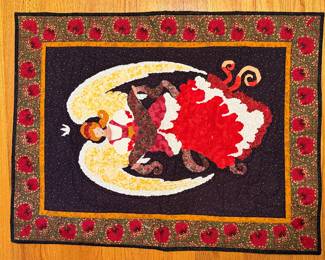 Handmade applique quilt of a cat on a crescent moon with cherry border