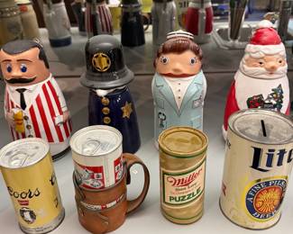 Beer brand steins and a Santa character stein