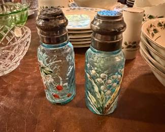 Mason jars with painted decoration and dinnerware stacks
