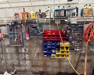 Garage wall with parts bins and motor oil
