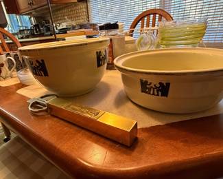 Stoneware mixing bowls and a wood cutting board