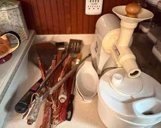 Cabinet of white serving dishes and kitchen utensils