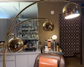 Basement bar with arc lamp and leather seating