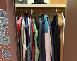 Closet of hanging coats and jackets