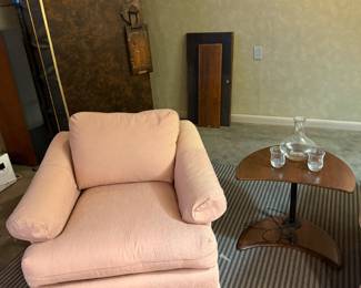 Upholstered armchair with a side table