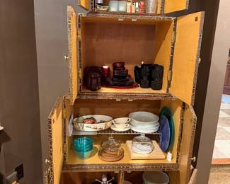 Wood cabinet with glassware and dishes