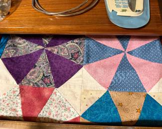 Pieced quilt top in a kaleidoscope star pattern