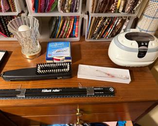 Omnigrid ruler, pin cushion and notions on a sewing table