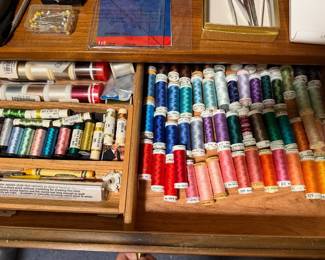 Drawers of sewing thread spools in a full color range