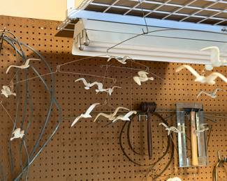 Pegboard with flying bird wall decor and hardware