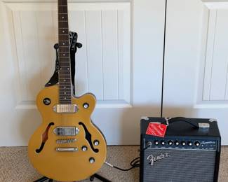 Epiphone Wildkat Studio MG guitar with Fender Champion 20 amplifier, strap and stand. Untested; see CTBids lot details.