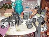 Much photographic equipment including a Brownie and a Nikon with lenses