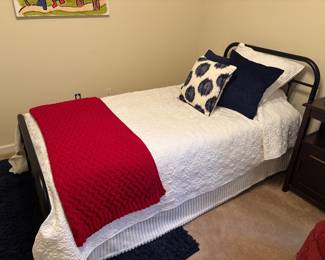 Iron twin bed and mattress. Rarely used. No pets. No smoke Bedding for sale too