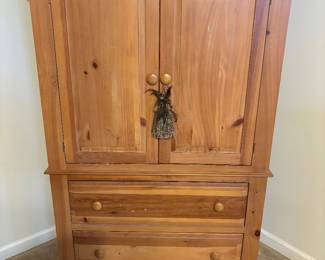 Broyhill bedroom armoire for TV. 2 large drawers at bottom. Great for storage. Great looking piece Very heavy and sturdy