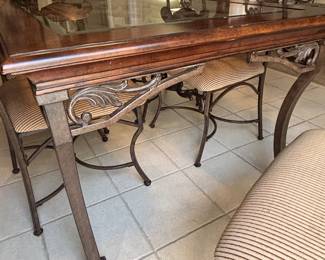 Wood, iron and glass kitchen table base details