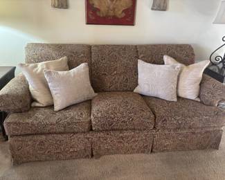 3 cushion Couch. Tan browns and reds.