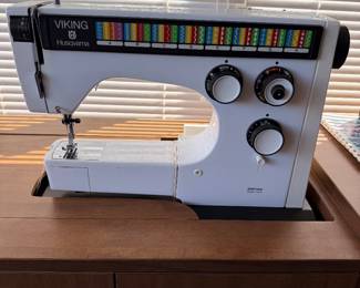 VIKING HUSQVARNA MACHINE WITH ATTACHMENTS IN SEWING CABINET