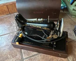 Antique sewing machine in wood case