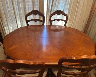 Table has padded cover and extra leaf