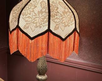 Antique cast iron lamp with fringe shade