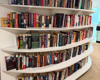 music and history books, including a yellow book featuring the faces of The Beatles (A Little Bit of The Beatles), followed by biographies and non-fiction titles on Richard Branson, Frank Sinatra, Bob Dylan