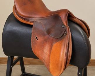 a brown leather English close contact / jumping saddle 