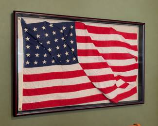 vintage 48 star U.S. American flag displayed inside a dark wood shadow box