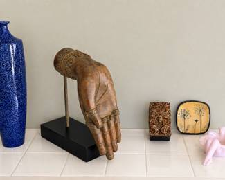 mounted Buddha hand sculpture 