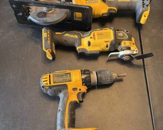 Cordless DeWalt power tools including a circular saw, an oscillating multi-tool, and a drill