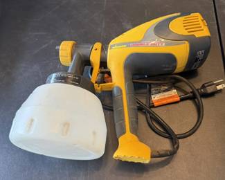 Wagner Control Spray Double Duty HVLP paint sprayer with attached plastic paint reservoir and power cord.
