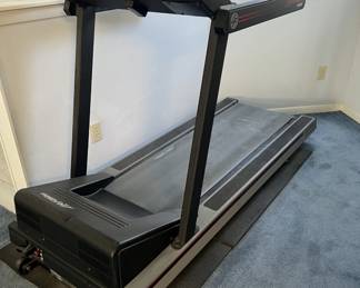 Life Fitness commercial motorized treadmill with front console and side handrails