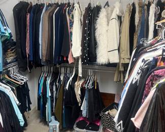 Large closet full of high end clothing