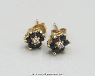 Lot 112: 10k gold blue and clear stone cluster earrings