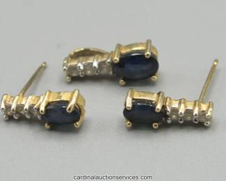 Lot 110: 14k gold sapphire and diamond pendant and earring set