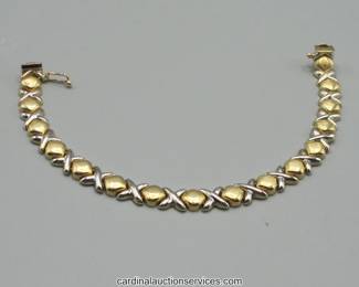 Lot 103: 14k two-tone gold X and O link bracelet, 7.5 inch, 11.3 grams
