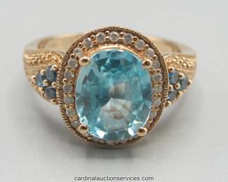 Lot 101: 14k gold blue topaz halo ring, size 7, 5.4 grams