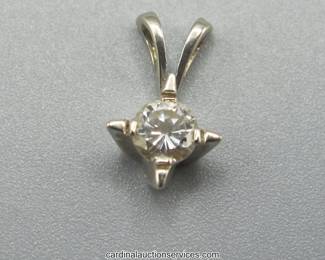 Lot 111: 14k gold round brilliant diamond solitaire pendant