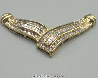 Lot 106: 10k gold baguette and round diamond chevron pendant, 4.0 grams