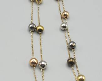 Lot 102: 14k tri-color gold station bead necklace, 25 inch