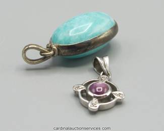 Lot 115: Sterling silver cabochon pendants, two