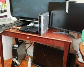TVs and computer on floor that has been reset and wiped of all personal info