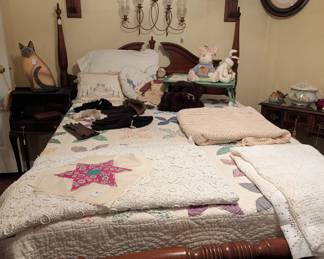 Four poster bed, mantel and old quilts 