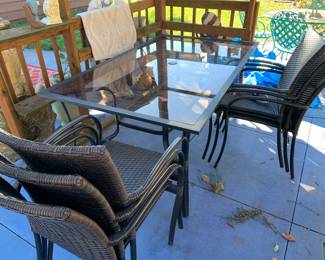 Like New Cast Aluminum Patio Table with outdoor wicker stacking chairs