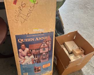 Brand new doll house and box of accessories 