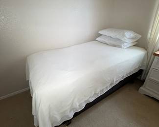 Guest room bed, crisp and cozy.