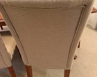 Clean, simple chair backs, ready for dinner guests.
